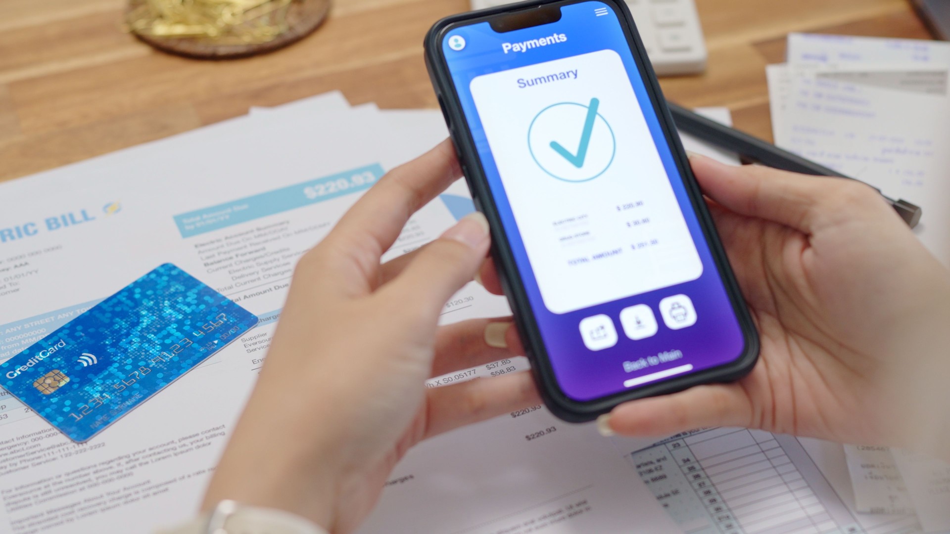 Close up Asian woman holding smartphone use credit card checking  for make online utility bill payment ,contactless Internet banking  technology and money transfer